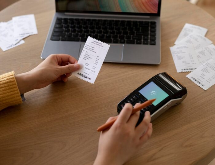 Business professional working on digital invoices on a laptop in UAE